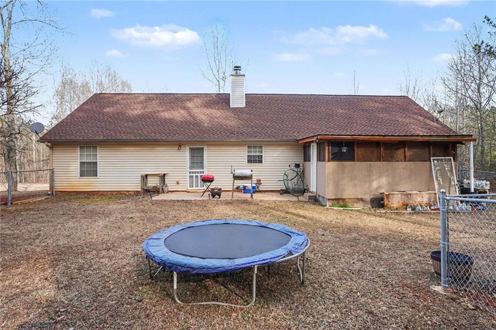 204 Hailey Lane Griffin, GA 30223 - Photo 29 of 32 a view of a house with backyard space and chair