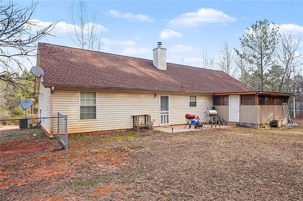 204 Hailey Lane Griffin, GA 30223 - Photo 30 of 32 a view of a house with a patio and a yard