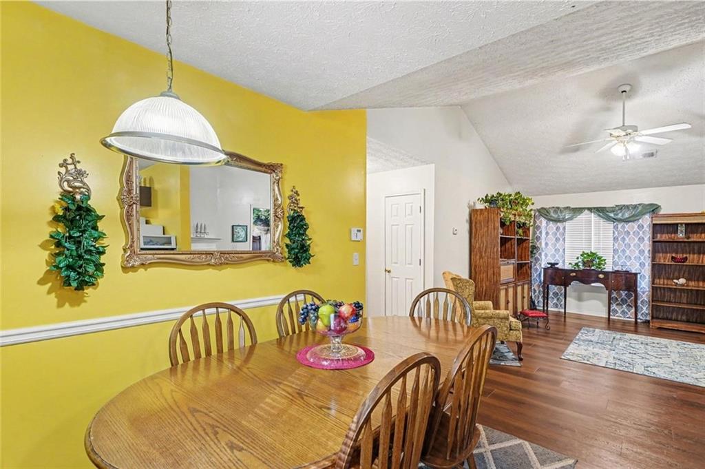 204 Hailey Lane Griffin, GA 30223 - Photo 10 of 32 a dining room with furniture and wooden floor