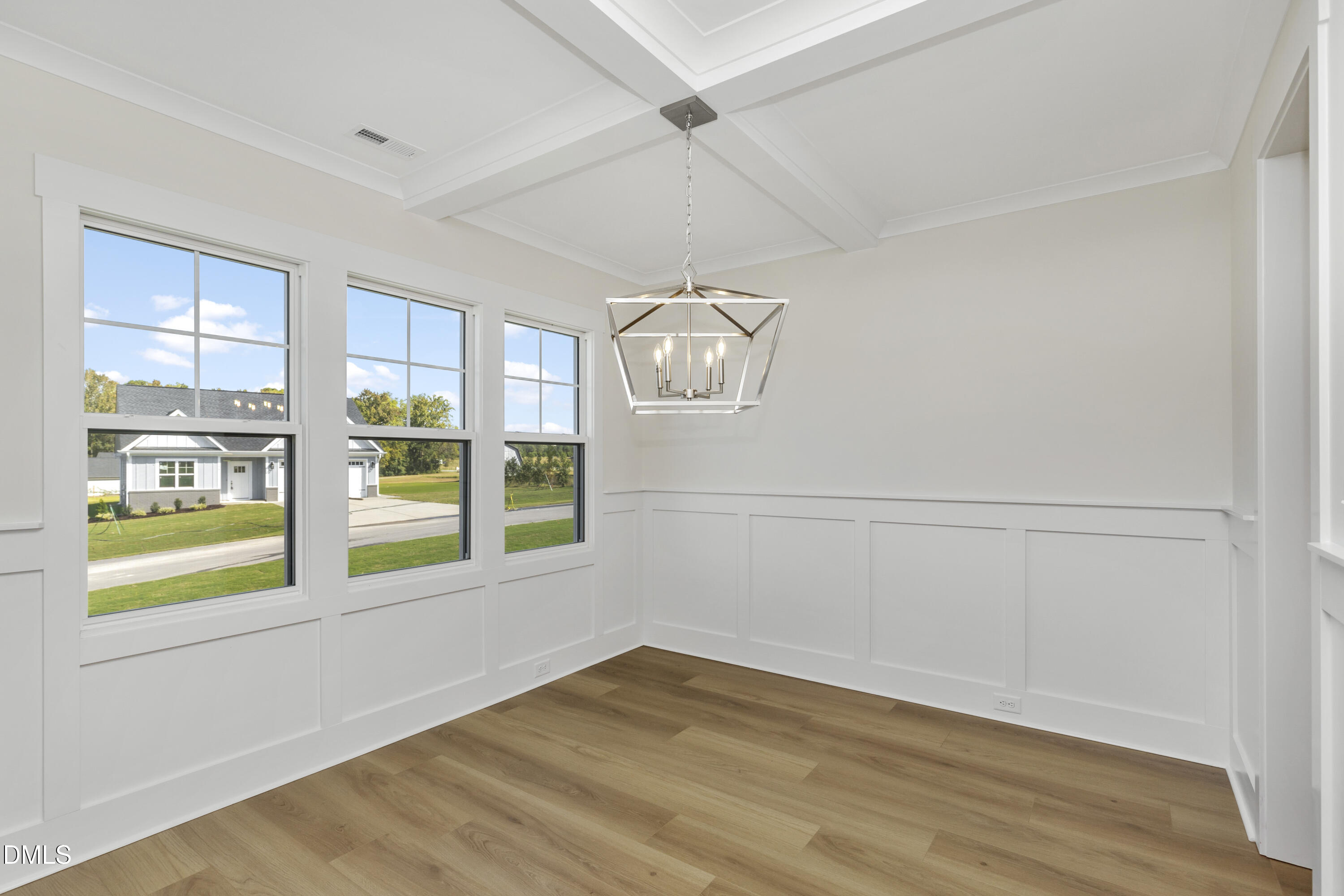 61 Croatoke Court Angier, NC 27501 - Photo 15 of 36 a view of an empty room with a window and kitchen view