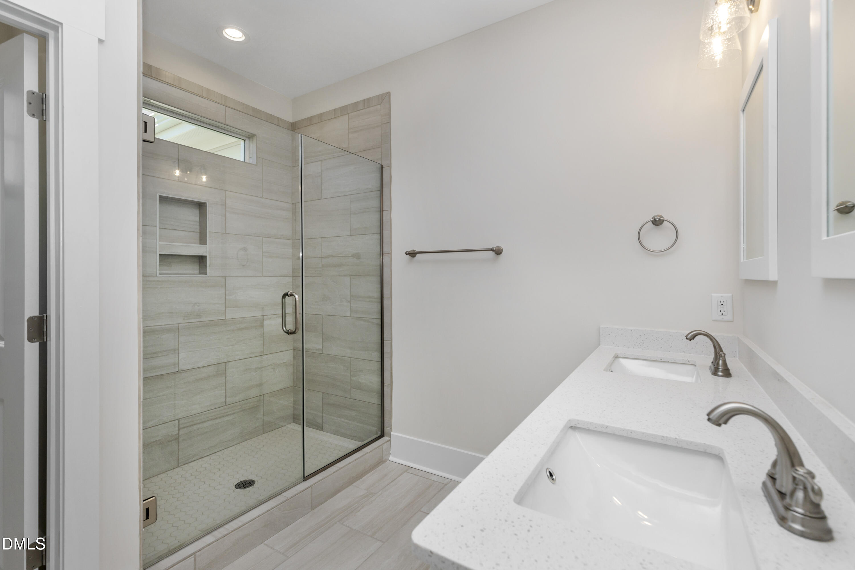 61 Croatoke Court Angier, NC 27501 - Photo 21 of 36 a bathroom with a sink and shower