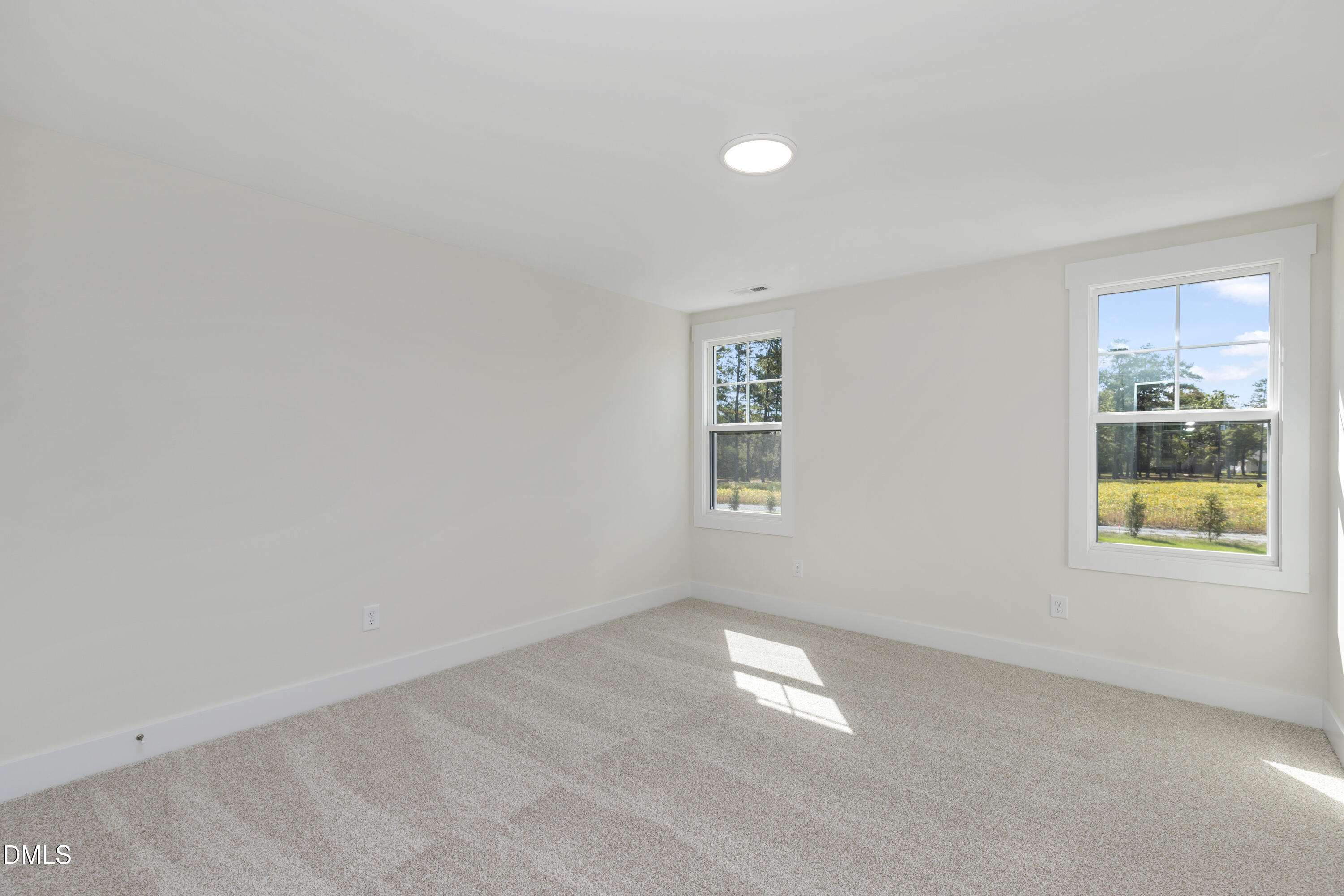 61 Croatoke Court Angier, NC 27501 - Photo 24 of 36 an empty room with windows