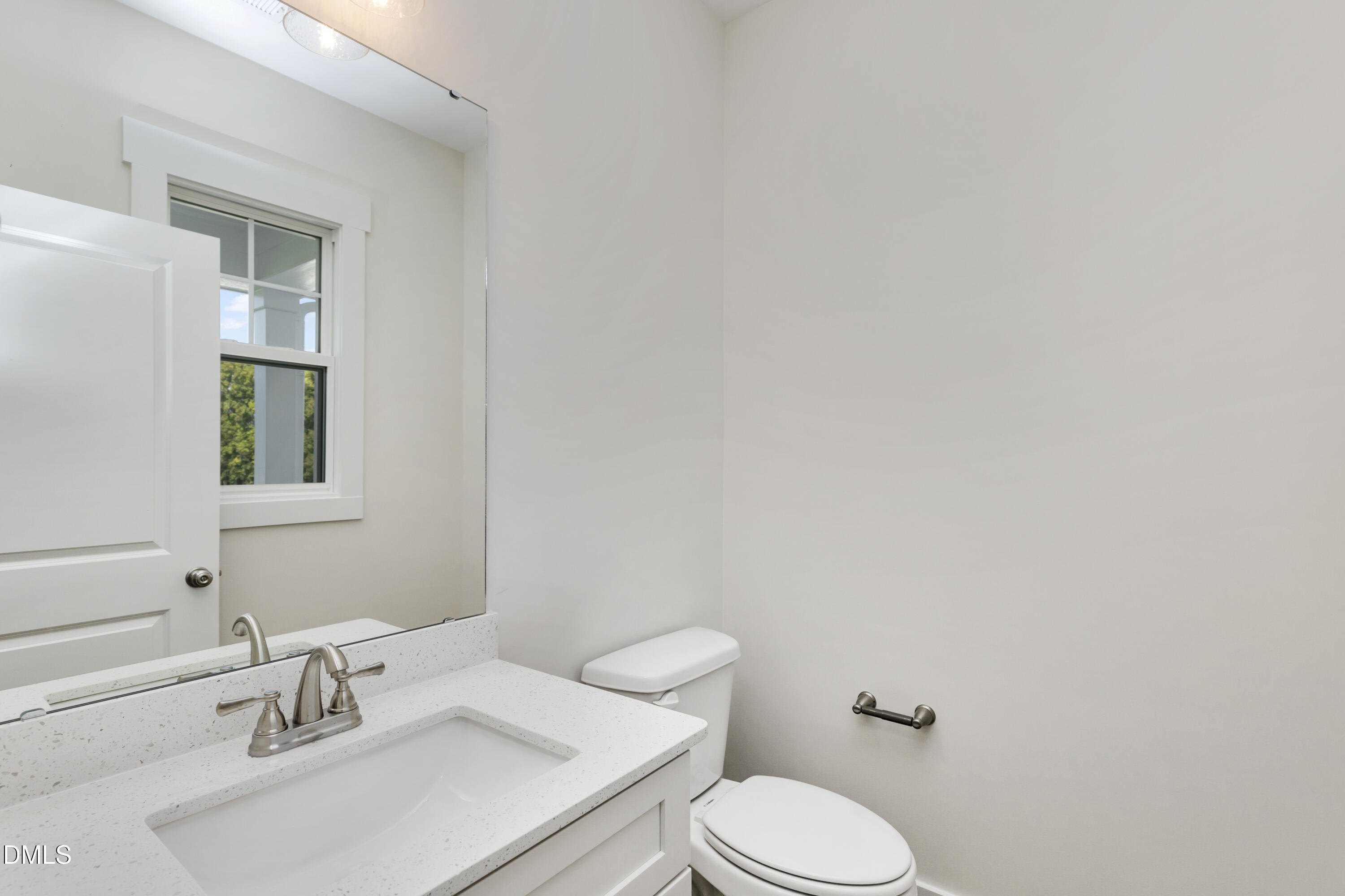 61 Croatoke Court Angier, NC 27501 - Photo 30 of 36 a bathroom with a sink and a toilet
