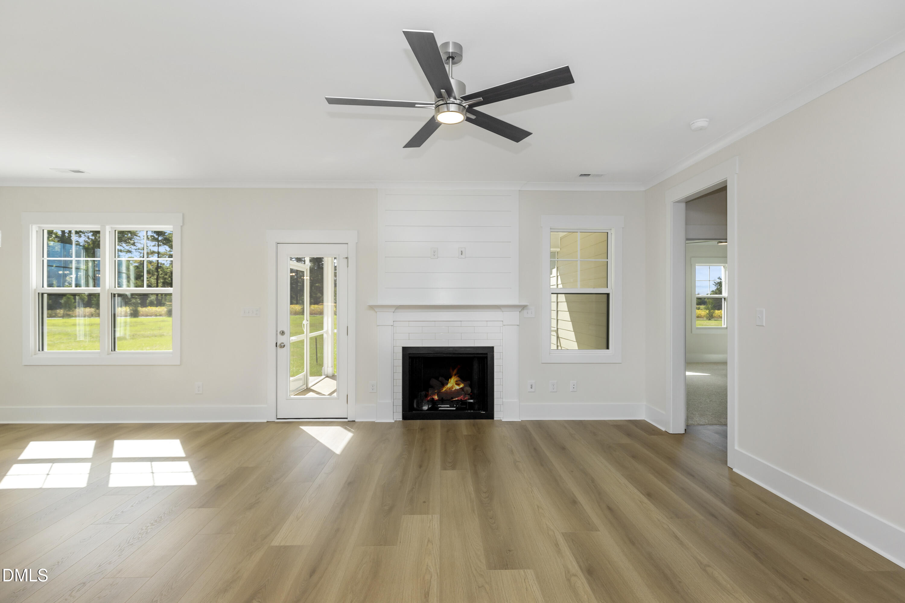 61 Croatoke Court Angier, NC 27501 - Photo 7 of 36 a view of a livingroom with a fireplace and window