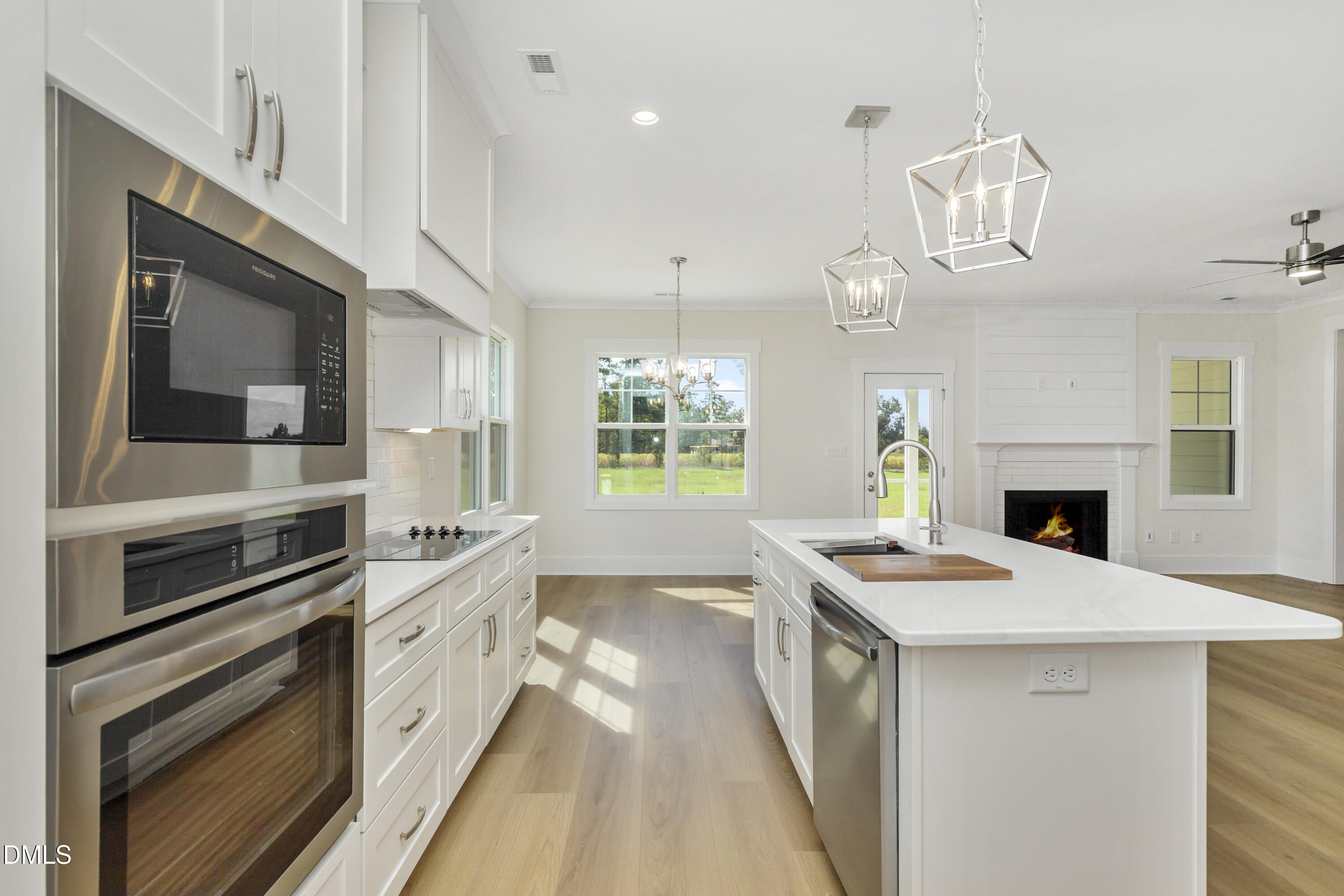 61 Croatoke Court Angier, NC 27501 - Photo 8 of 36 a kitchen with a stove and a white cabinets