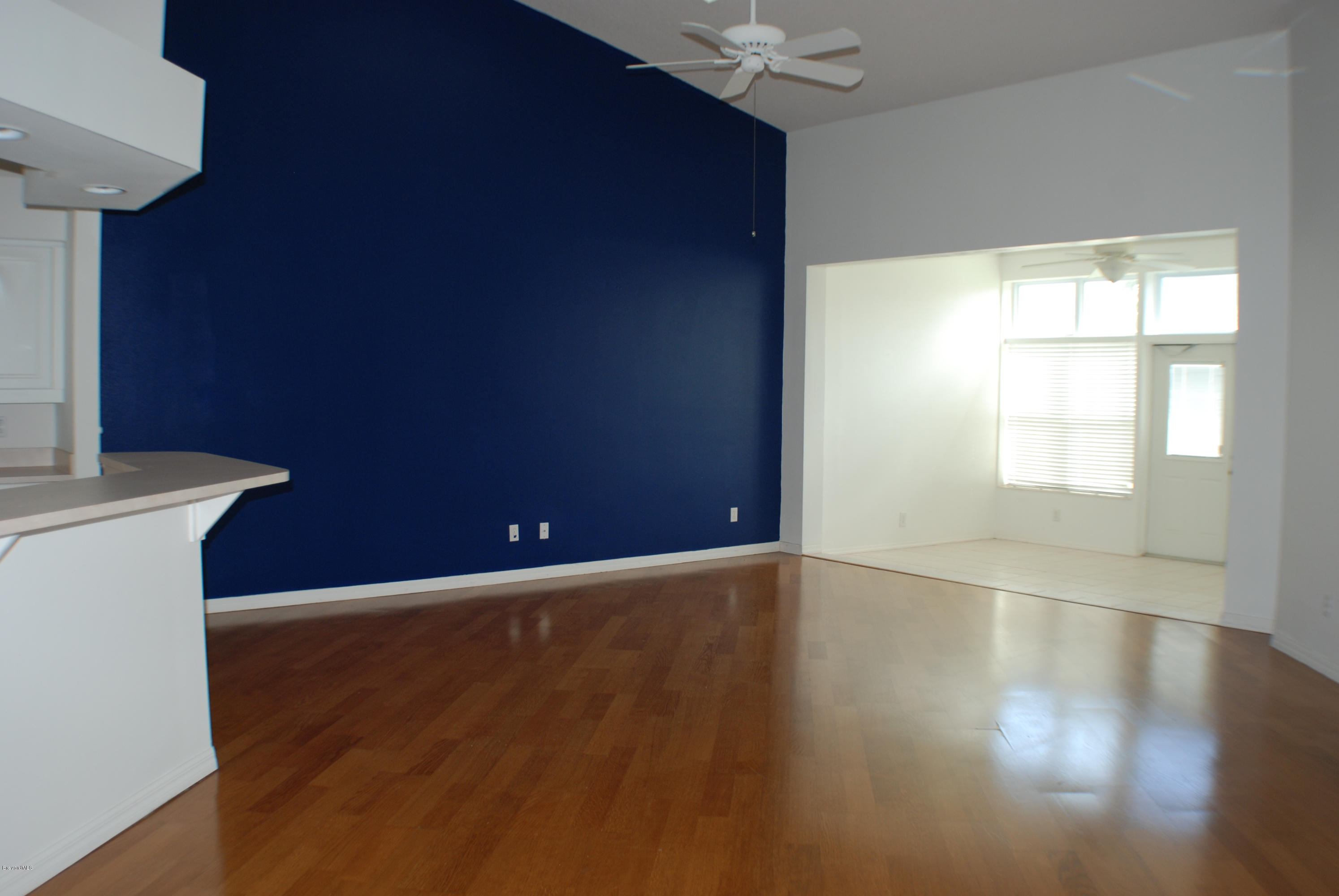549 Renaissance Avenue Melbourne, FL 32940 - Photo 2 of 15 Living Room & Enclosed Florida Room