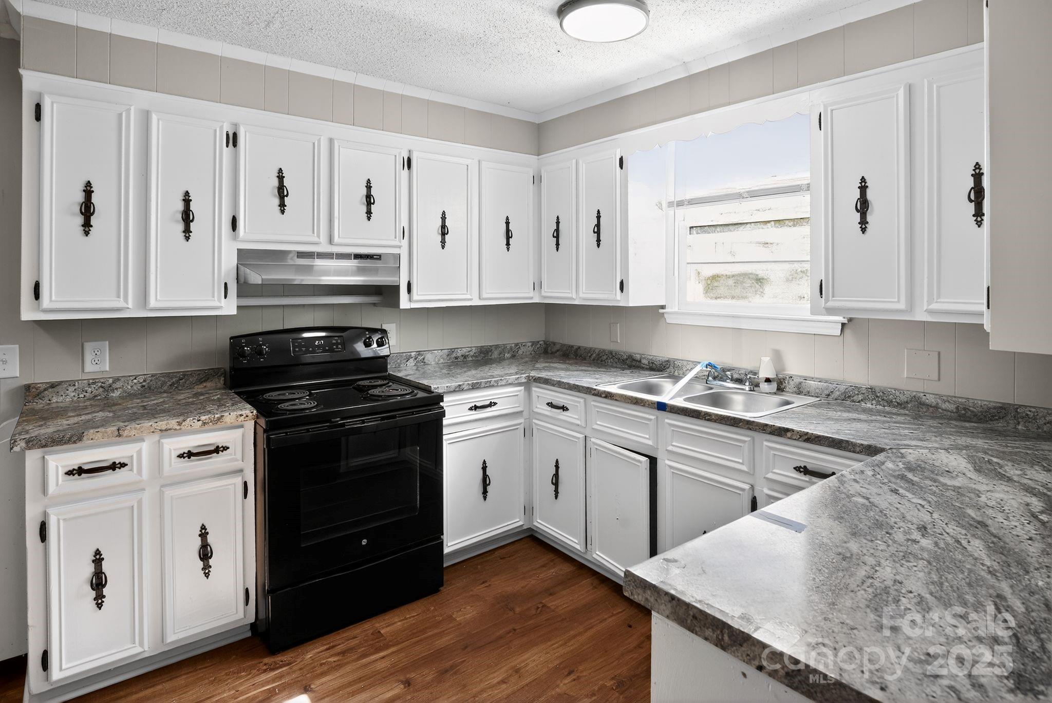 1527 Burnside Avenue Columbia, SC 29209 - Photo 15 of 31 a kitchen with granite countertop a sink cabinets and stainless steel appliances