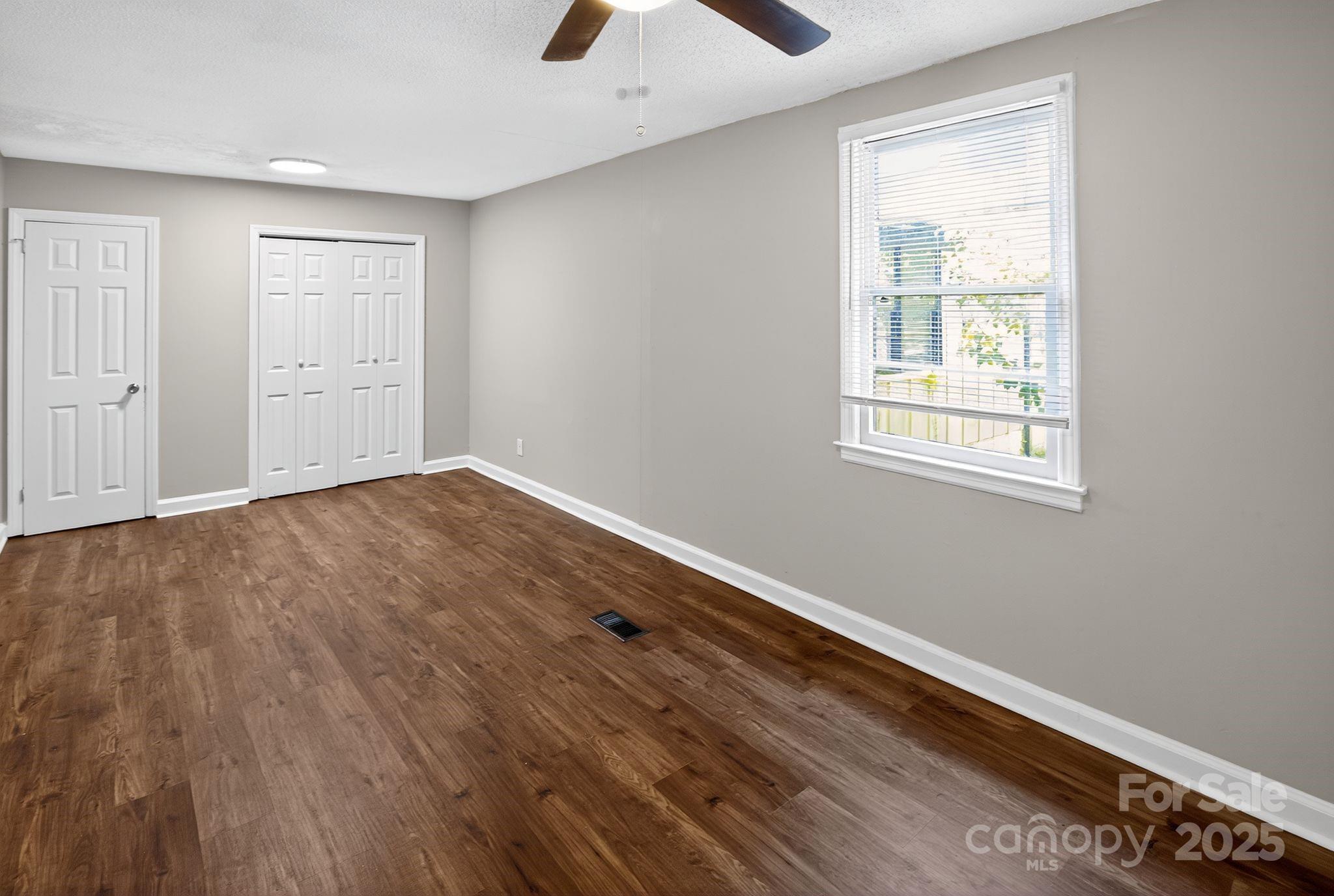1527 Burnside Avenue Columbia, SC 29209 - Photo 20 of 31 wooden floor in an empty room with a window