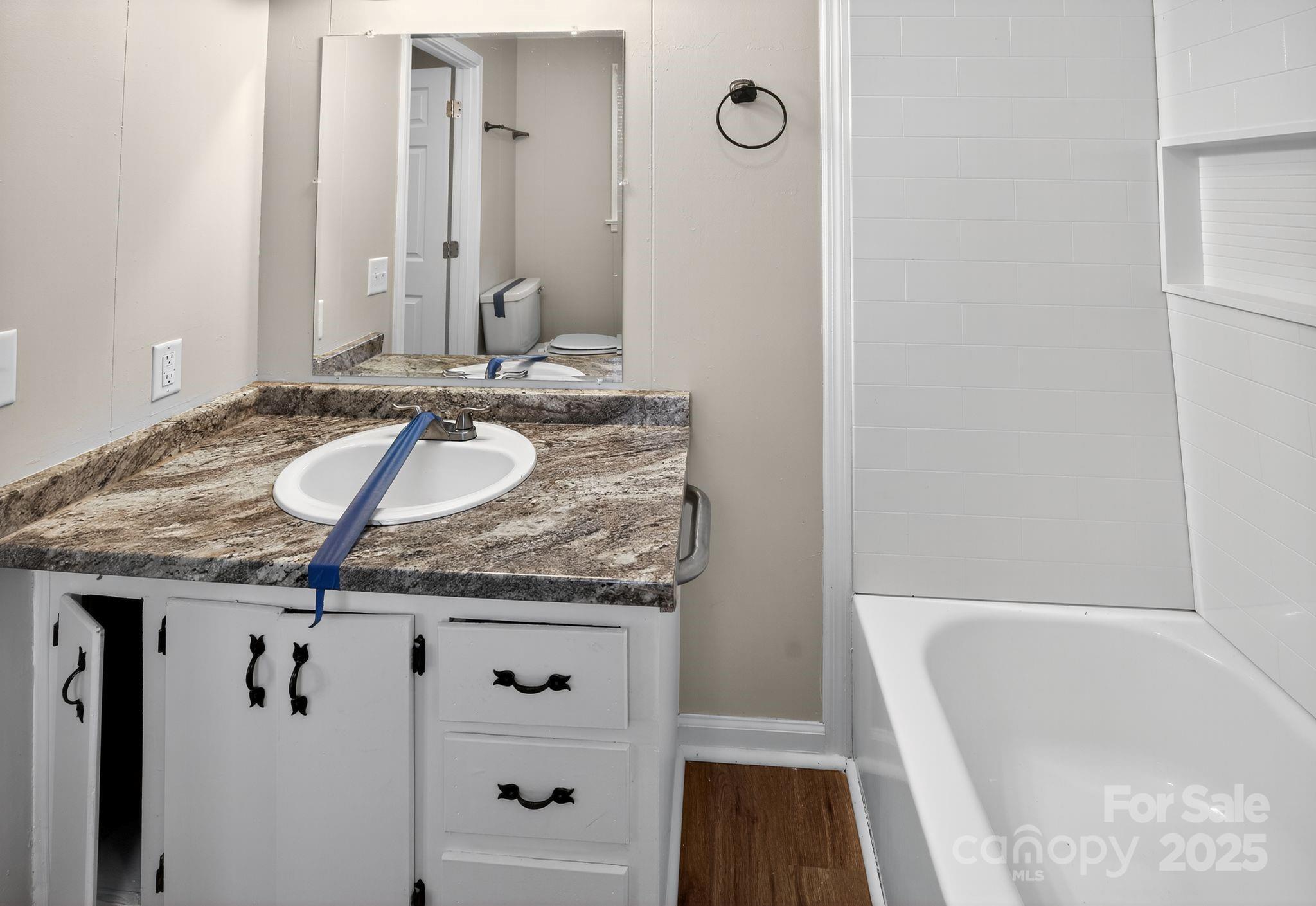 1527 Burnside Avenue Columbia, SC 29209 - Photo 22 of 31 a bathroom with a granite countertop sink and a mirror