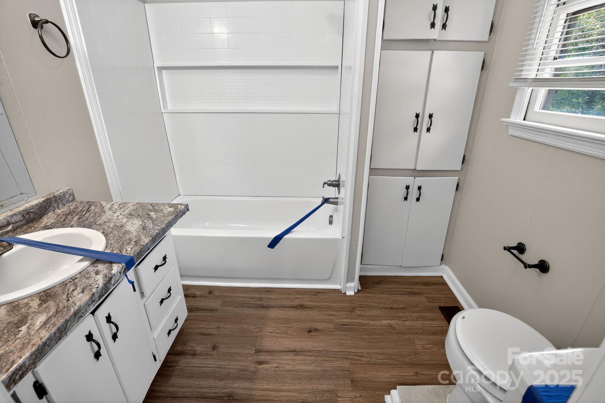 1527 Burnside Avenue Columbia, SC 29209 - Photo 23 of 31 a bathroom with a granite countertop sink toilet and shower