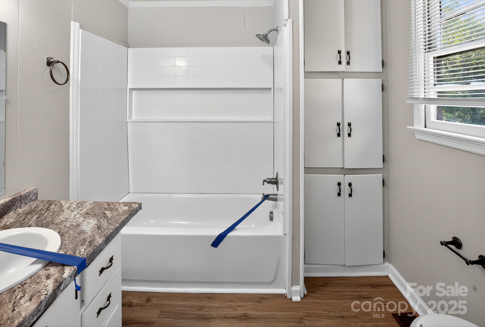 1527 Burnside Avenue Columbia, SC 29209 - Photo 26 of 31 a bathroom with a granite countertop tub and shower