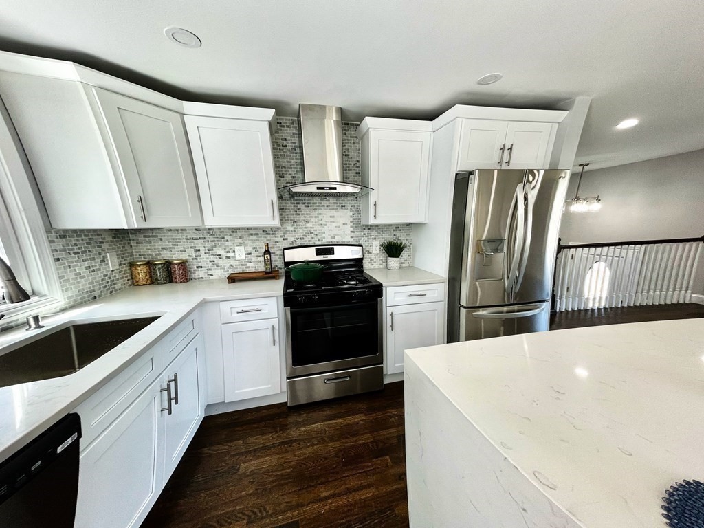 18 Haskell Road Pepperell, MA 01463 - Photo 17 of 36 a kitchen with a white cabinets and stainless steel appliances