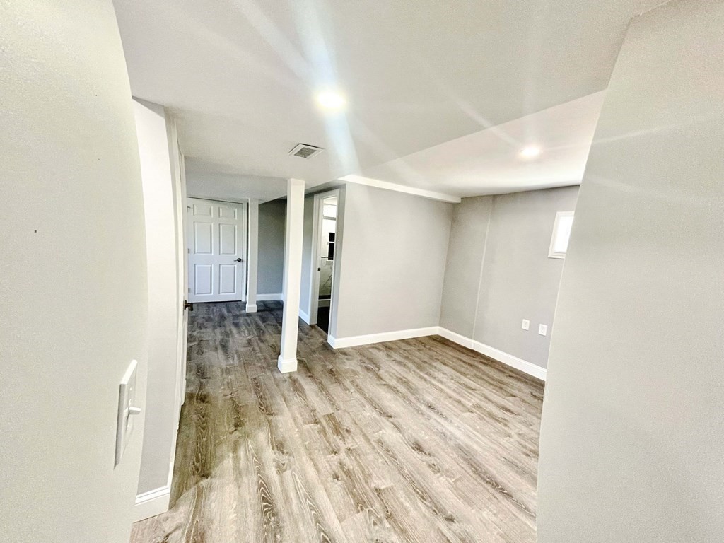 18 Haskell Road Pepperell, MA 01463 - Photo 35 of 36 a view of an empty room and wooden floor