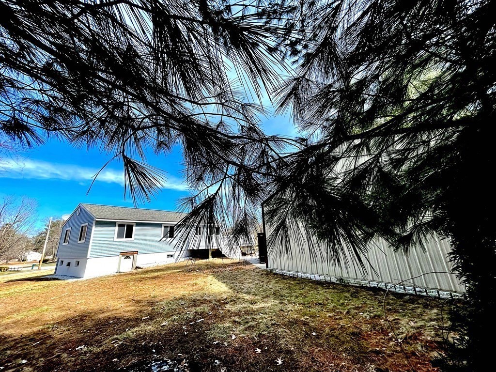 18 Haskell Road Pepperell, MA 01463 - Photo 5 of 36 a view of a house with a yard