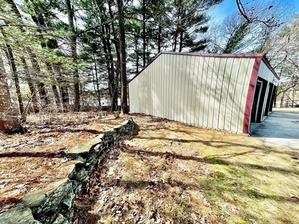 18 Haskell Road Pepperell, MA 01463 - Photo 6 of 36 a backyard of a house