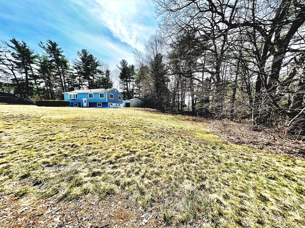 18 Haskell Road Pepperell, MA 01463 - Photo 10 of 36 a view of a yard with a tree