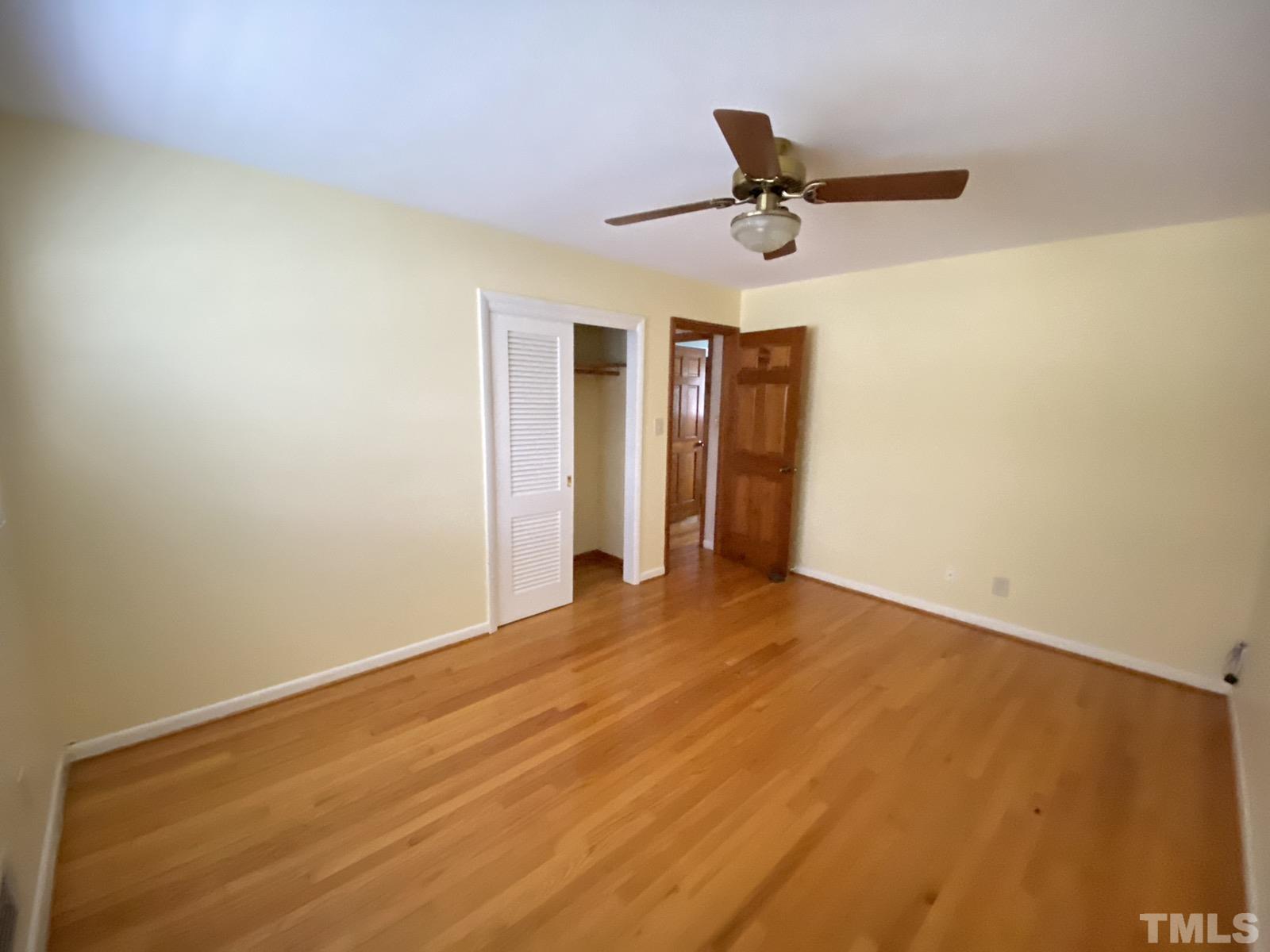 711 Kildaire Farm Road Cary, NC 27511 - Photo 13 of 19 a view of empty room with ceiling fan