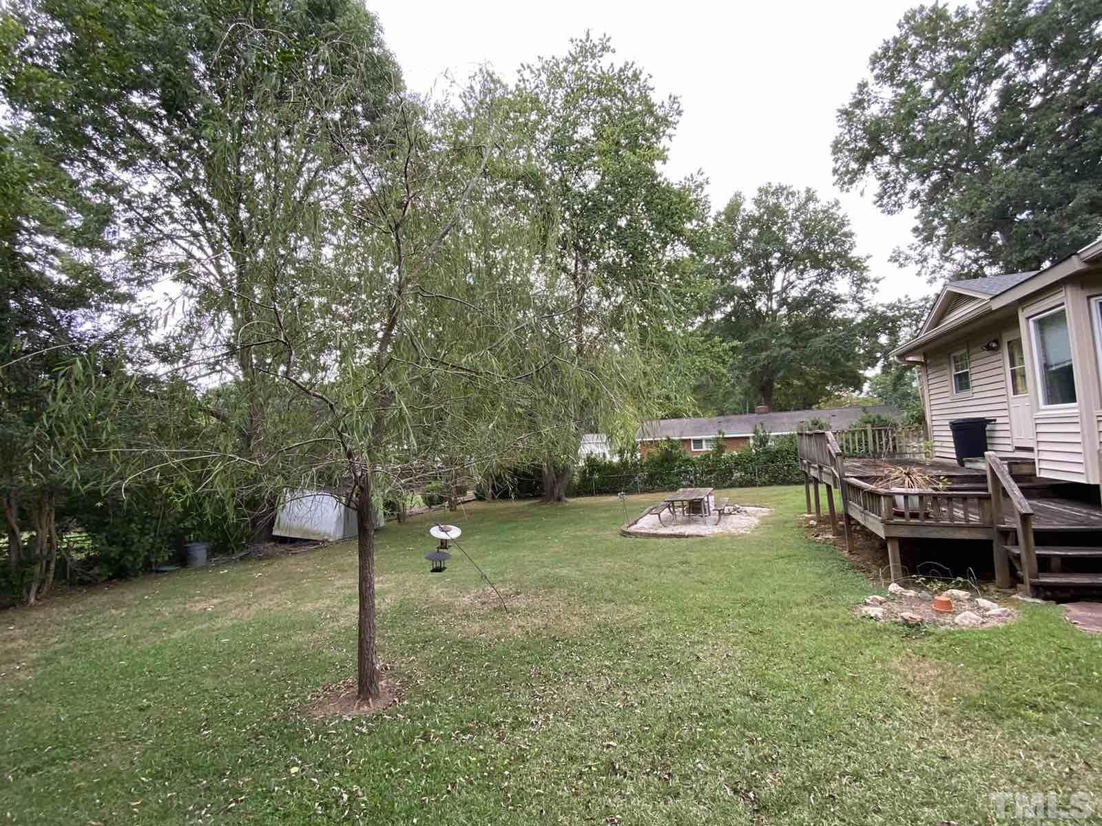 711 Kildaire Farm Road Cary, NC 27511 - Photo 16 of 19 a backyard of a house with lots of green space