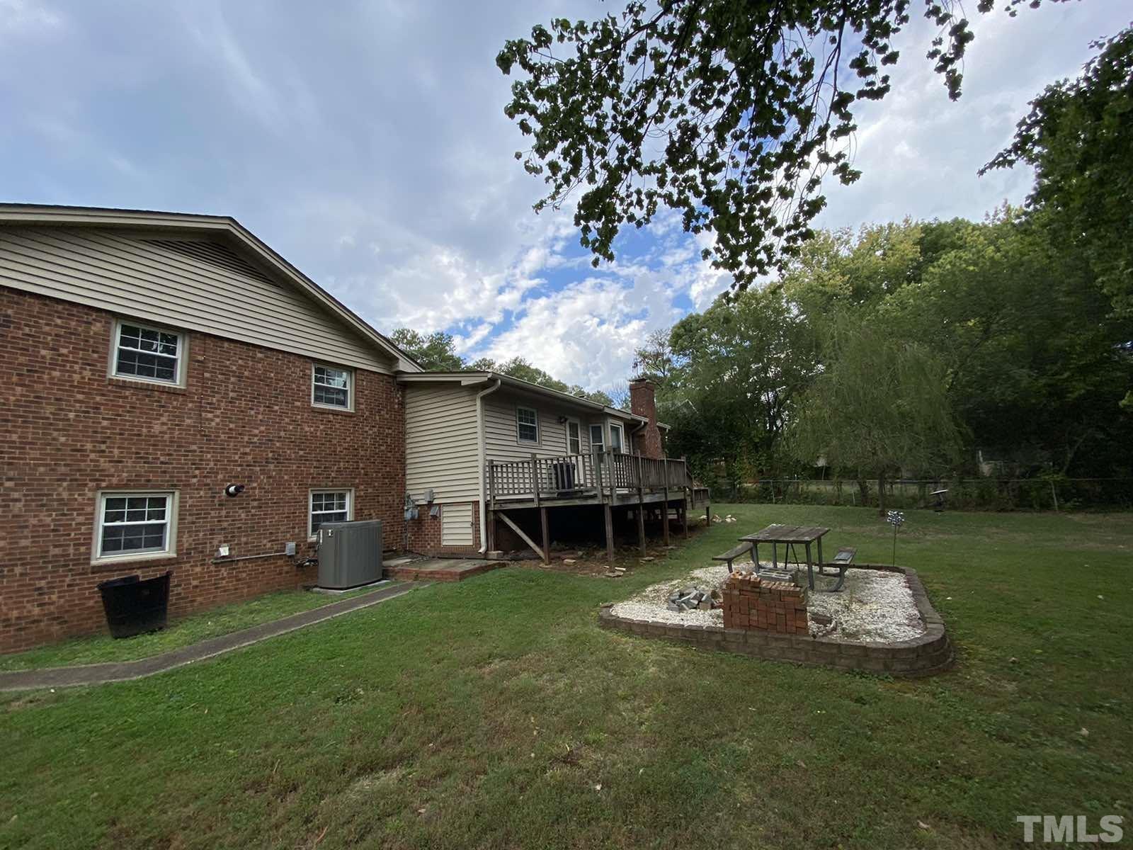 711 Kildaire Farm Road Cary, NC 27511 - Photo 19 of 19 a backyard of a house with table and chairs