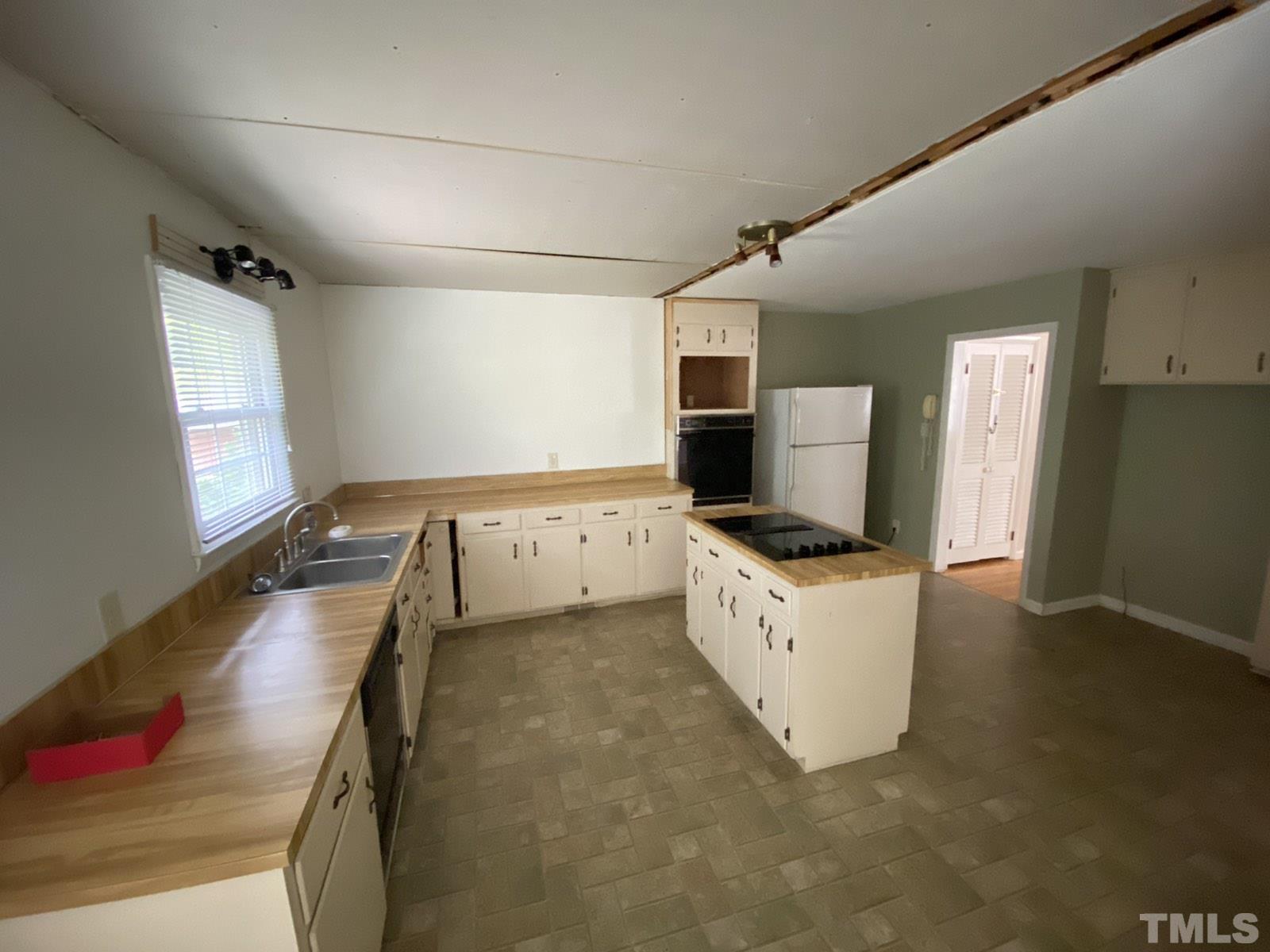 711 Kildaire Farm Road Cary, NC 27511 - Photo 4 of 19 a kitchen with stainless steel appliances granite countertop a sink and cabinets