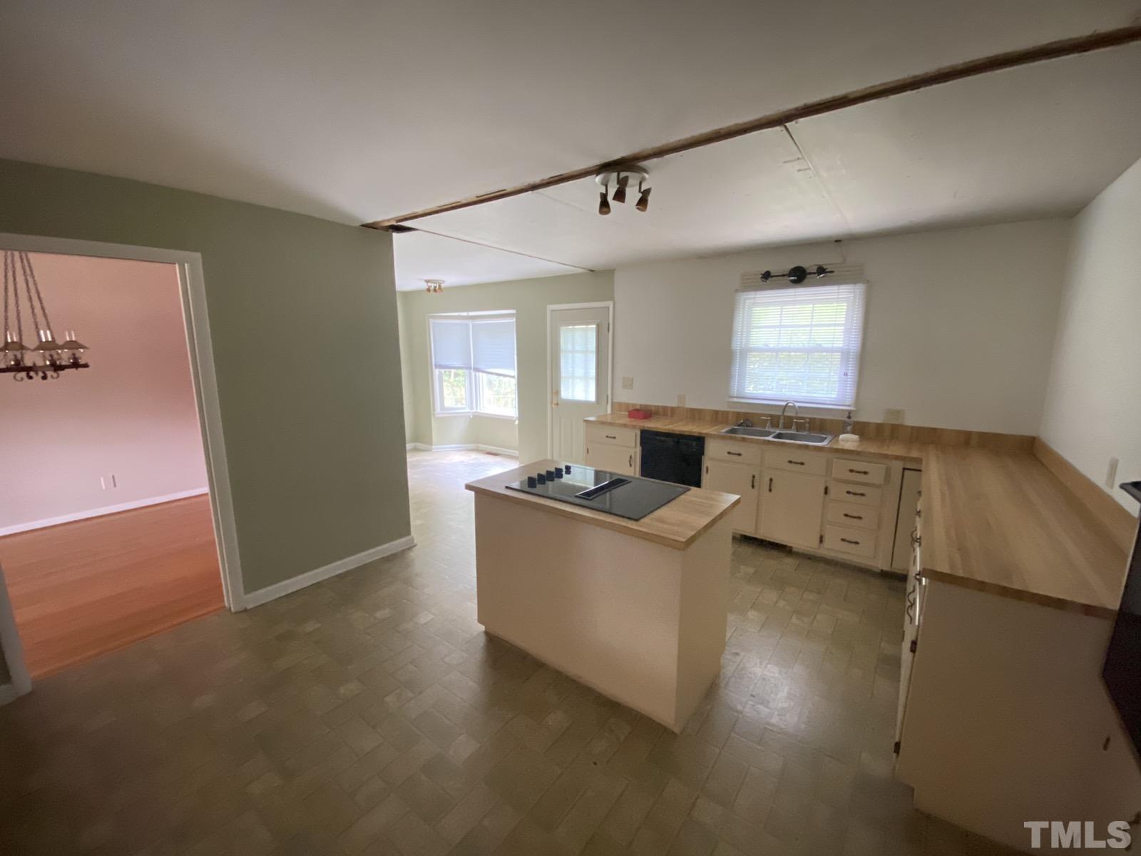 711 Kildaire Farm Road Cary, NC 27511 - Photo 5 of 19 a living room with a couch and a table