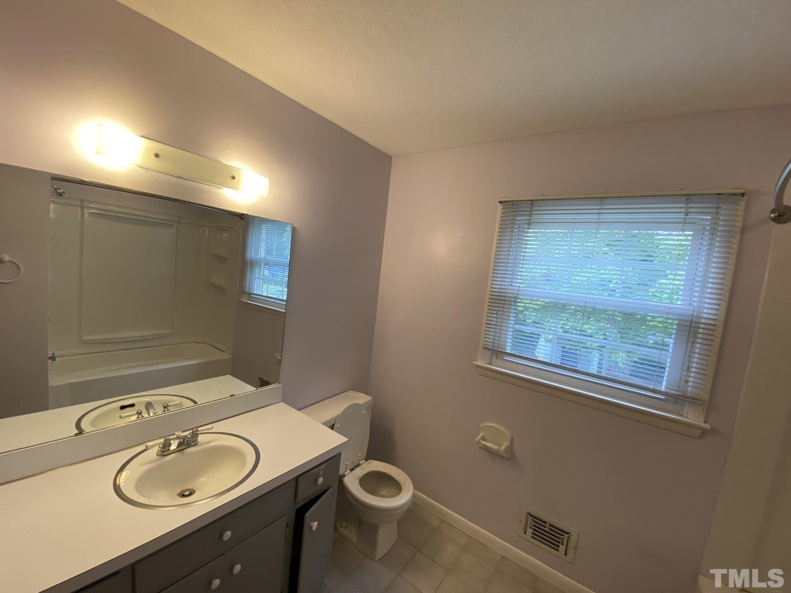 711 Kildaire Farm Road Cary, NC 27511 - Photo 7 of 19 a bathroom with a sink toilet and mirror