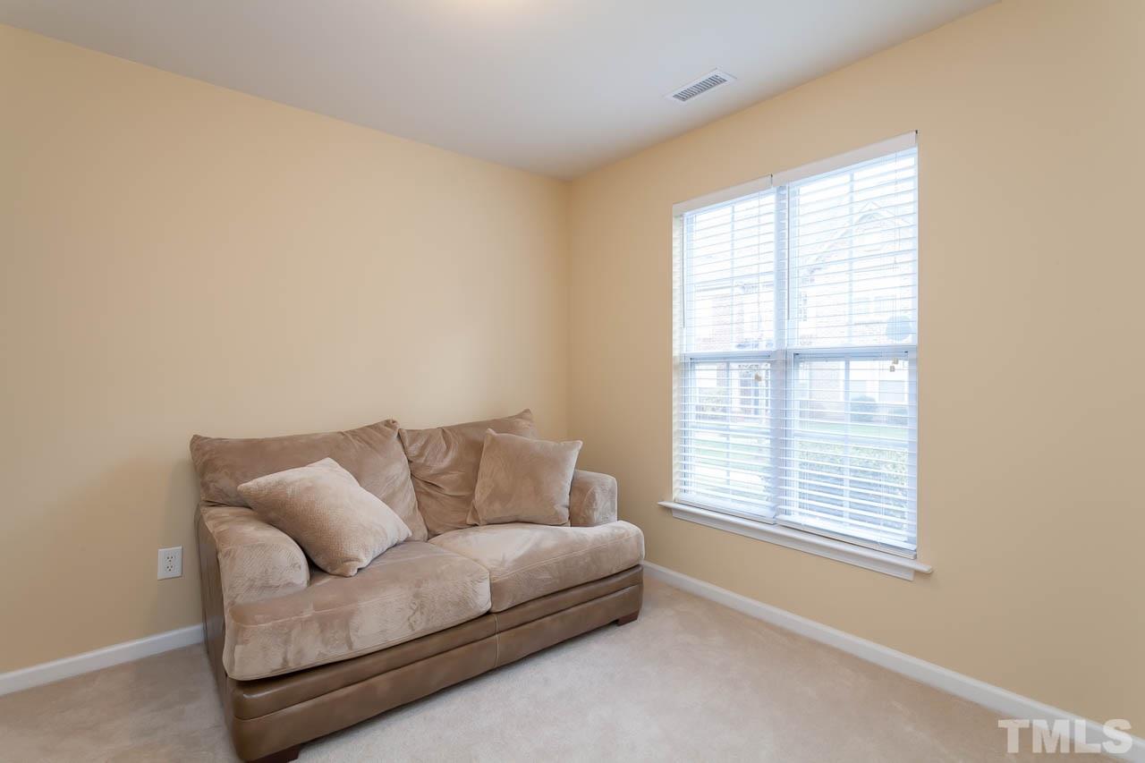 9909 Kedzie Court Raleigh, NC 27617 - Photo 16 of 22 a living room with furniture and a window