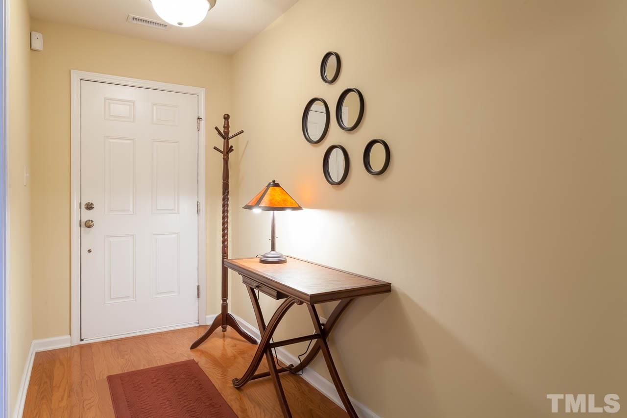 9909 Kedzie Court Raleigh, NC 27617 - Photo 17 of 22 a view of a room with a table and chairs