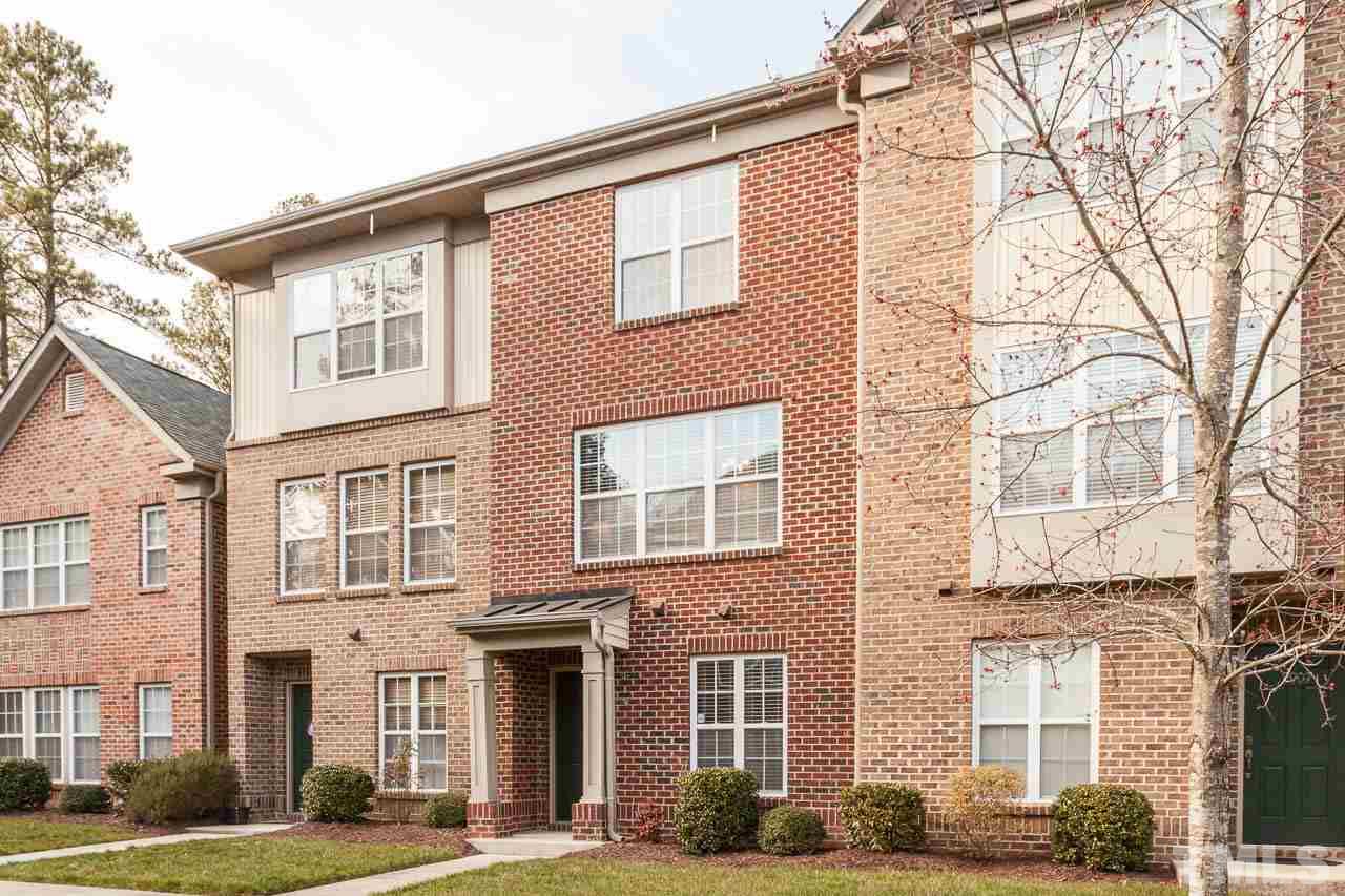 9909 Kedzie Court Raleigh, NC 27617 - Photo 20 of 22 front view of a brick house with a yard
