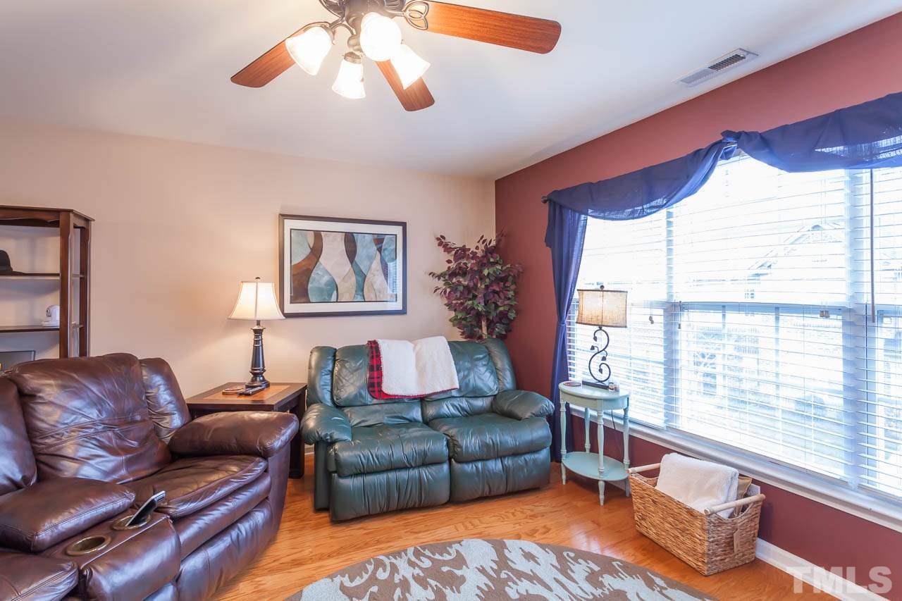 9909 Kedzie Court Raleigh, NC 27617 - Photo 9 of 22 a living room with furniture and a large window