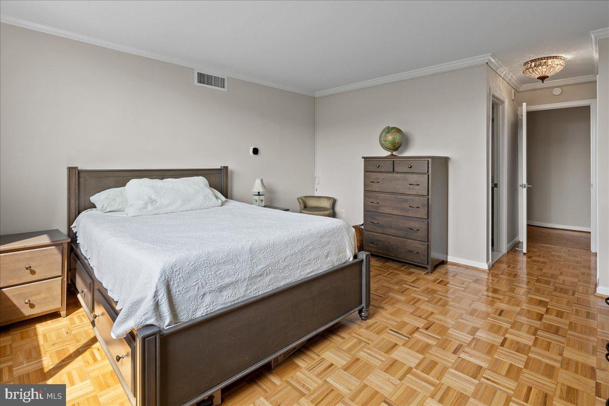 1101 South Arlington Ridge Road, Unit 402 Arlington, VA 22202 - Photo 36 of 61 Serene bedroom with warm wood floors.