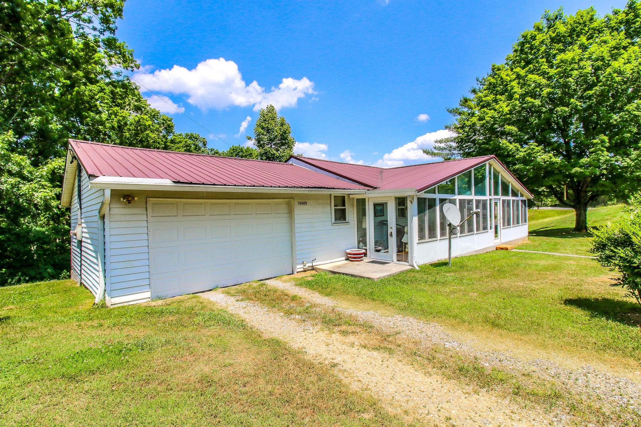 10425 Slemp Road Kodak, TN 37764 - Photo 2 of 21 a view of a house with a yard porch and sitting area