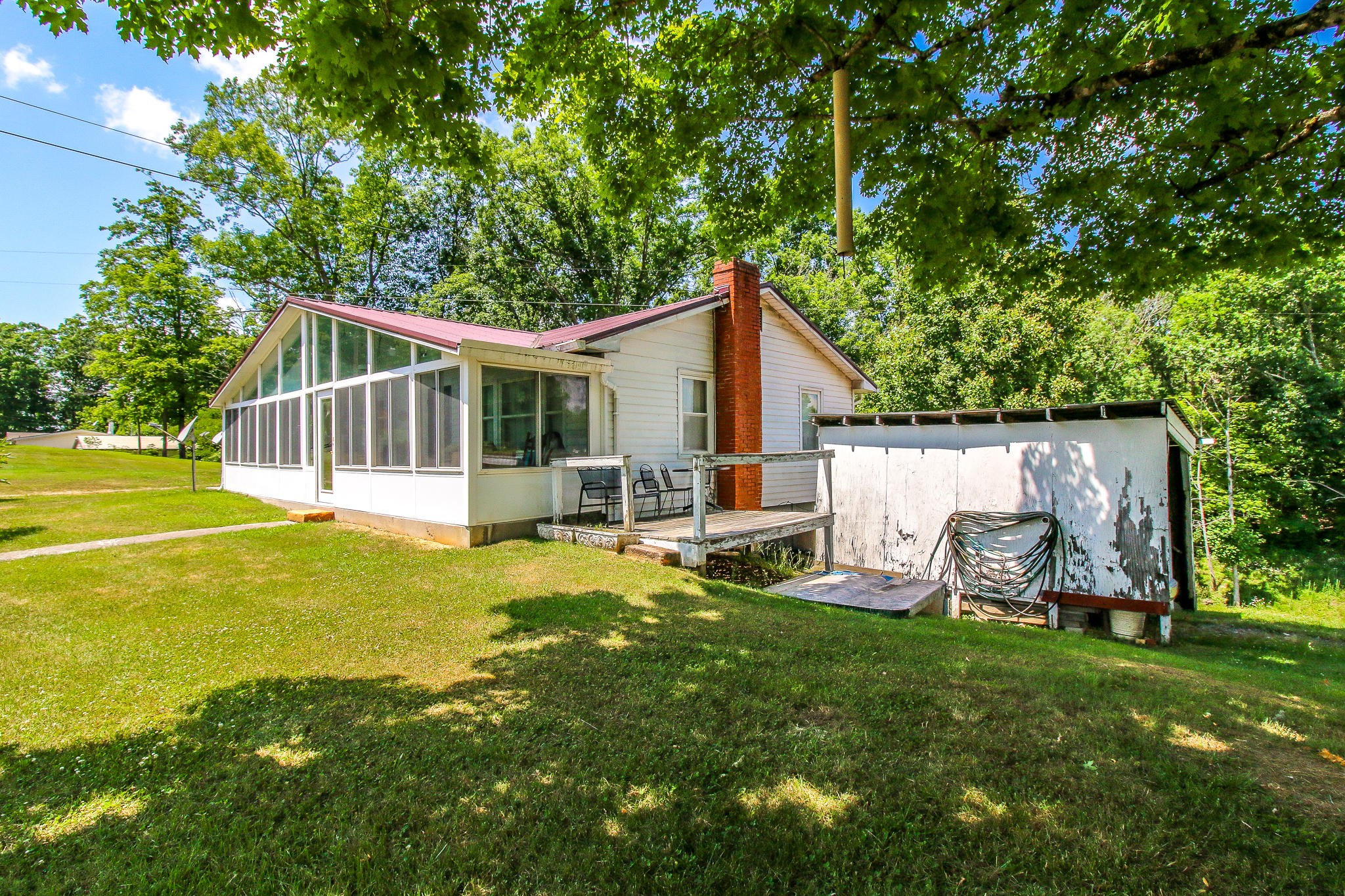 10425 Slemp Road Kodak, TN 37764 - Photo 3 of 21 a view of a house with backyard porch and sitting area