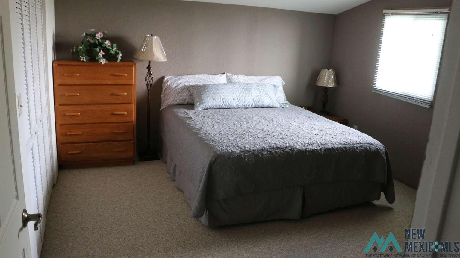 32 Dan Gatlin Road Pie Town, NM 87827 - Photo 39 of 43 Bedroom with light carpet
