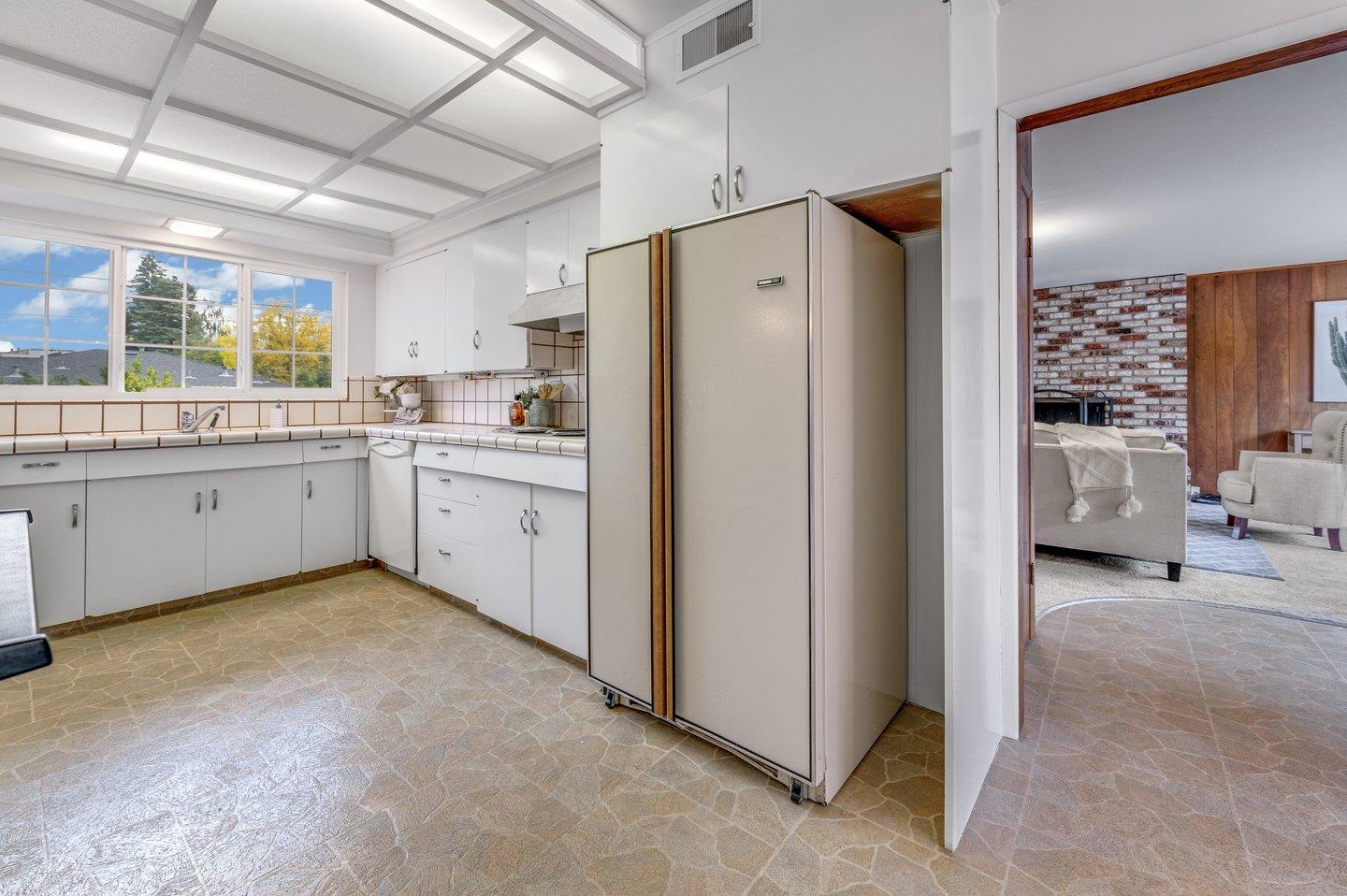 390 Cecelia Way Los Altos, CA 94022 - Photo 11 of 48 a kitchen with sink cabinets and refrigerator