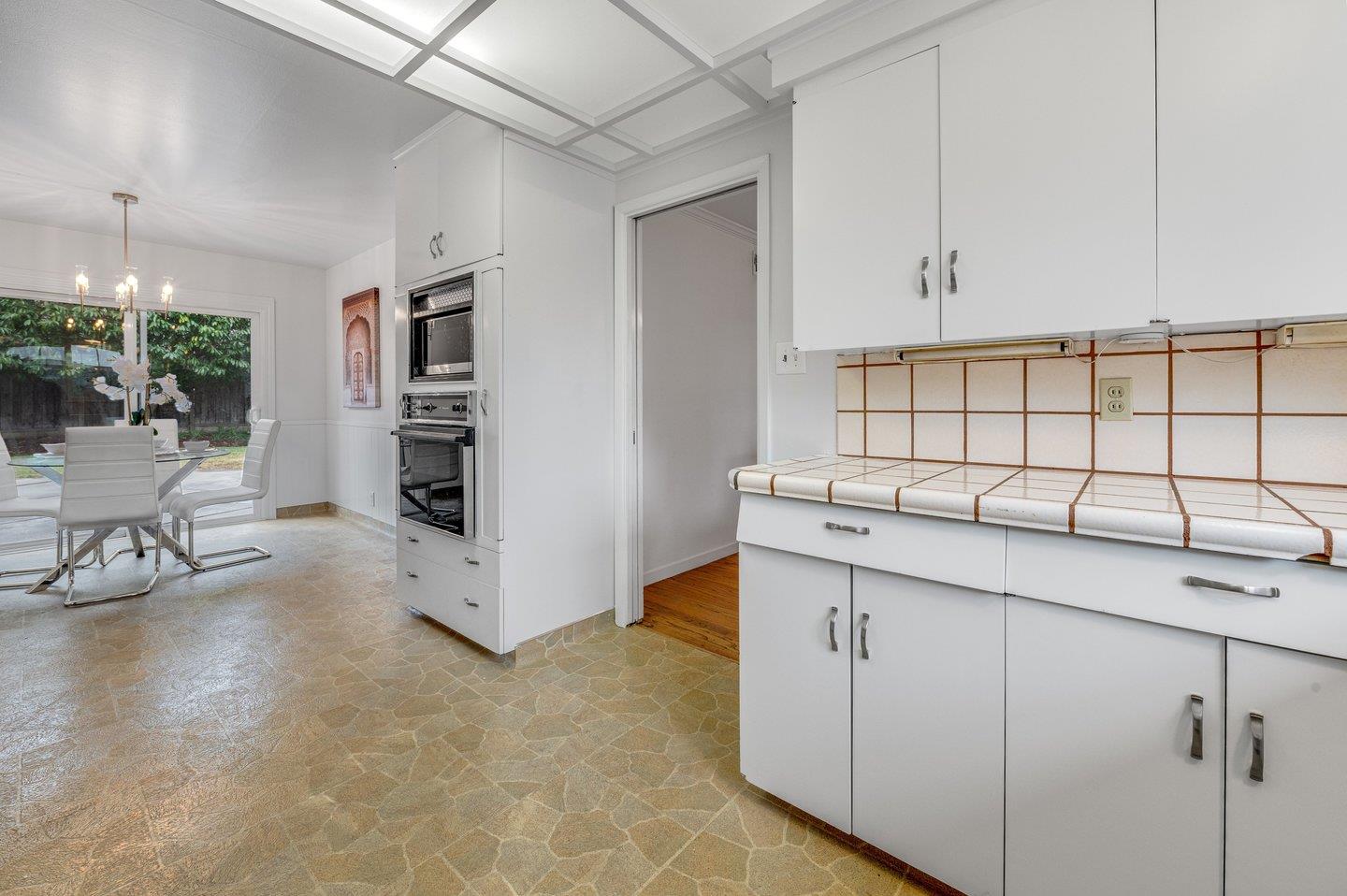 390 Cecelia Way Los Altos, CA 94022 - Photo 13 of 48 a kitchen with cabinets and chairs