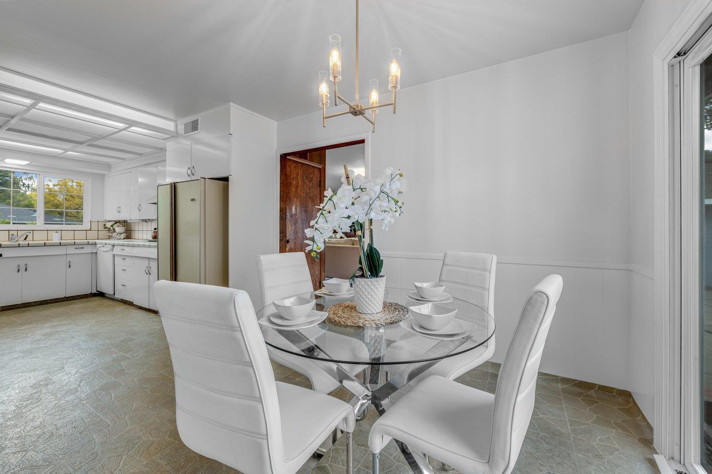390 Cecelia Way Los Altos, CA 94022 - Photo 15 of 48 a view of a dining room with furniture and chandelier