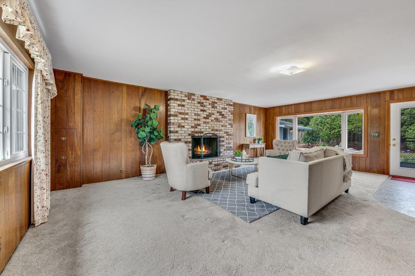 390 Cecelia Way Los Altos, CA 94022 - Photo 18 of 48 a living room with furniture and a fireplace