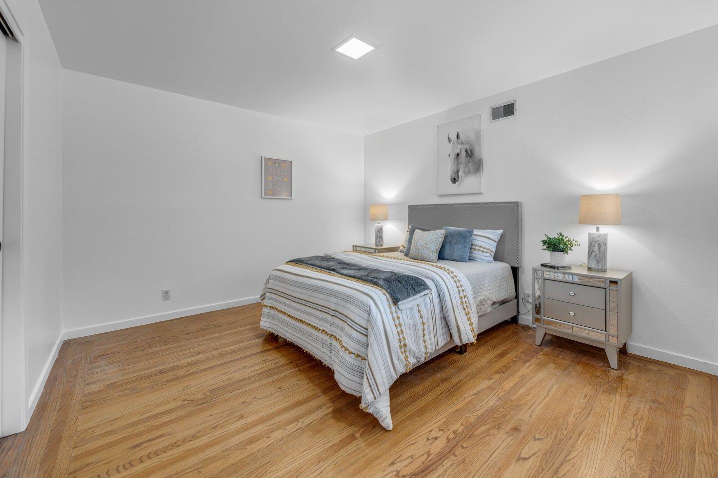 390 Cecelia Way Los Altos, CA 94022 - Photo 22 of 48 a bedroom with a bed and a desk