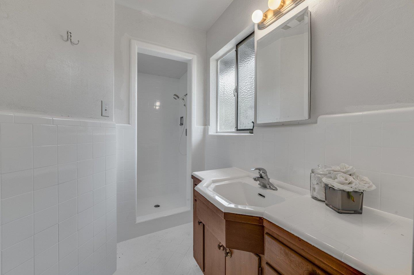 390 Cecelia Way Los Altos, CA 94022 - Photo 26 of 48 a bathroom with a sink and a mirror