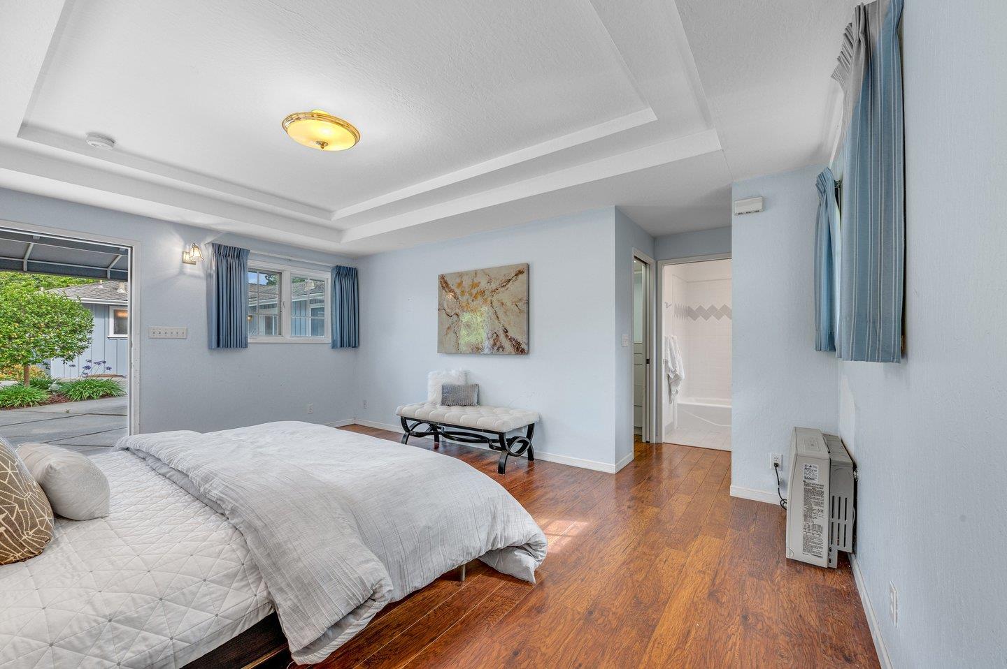 390 Cecelia Way Los Altos, CA 94022 - Photo 30 of 48 a bedroom with a bed and a wooden floor