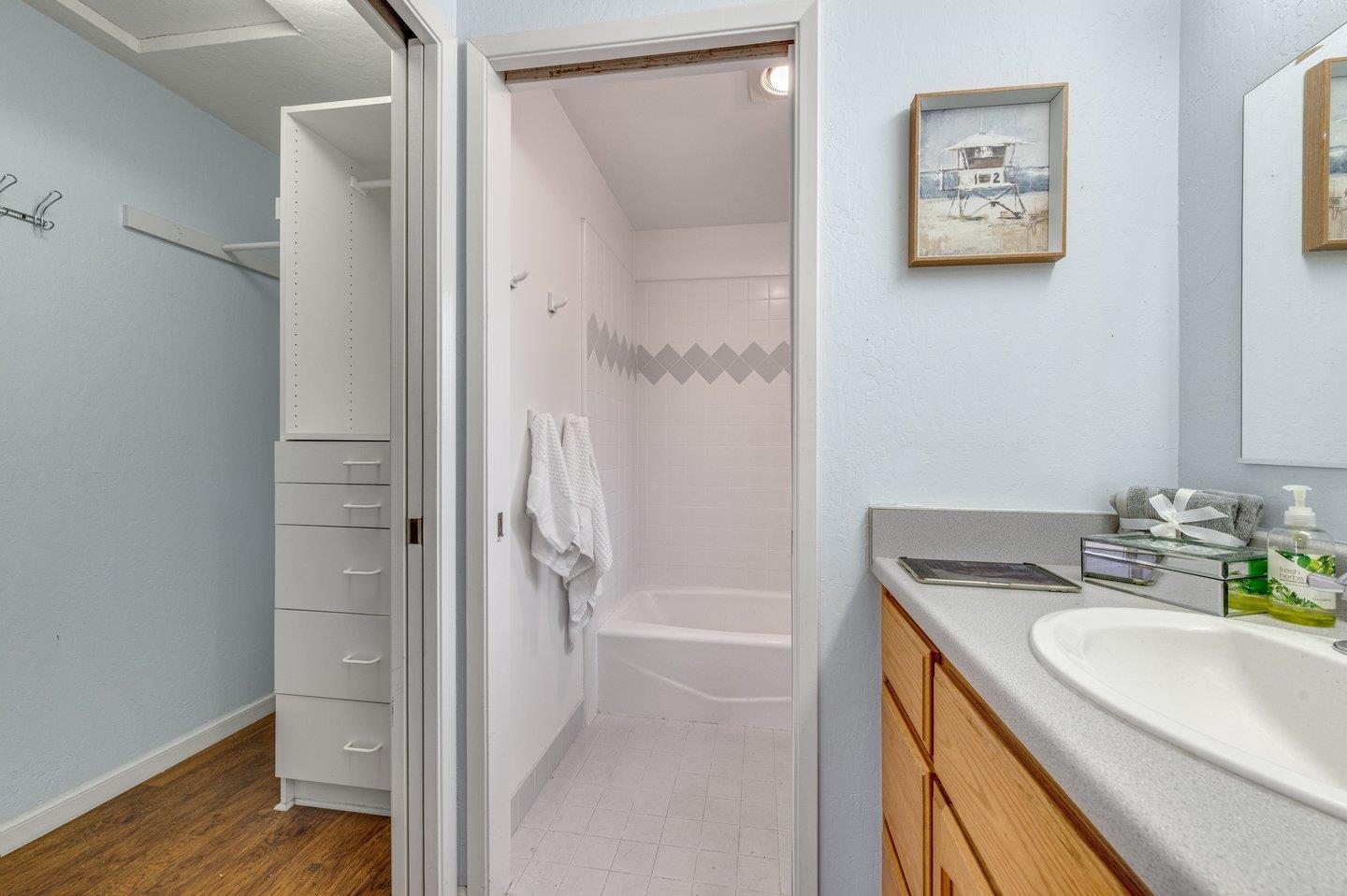 390 Cecelia Way Los Altos, CA 94022 - Photo 33 of 48 a bathroom with a granite countertop sink mirror and a shower