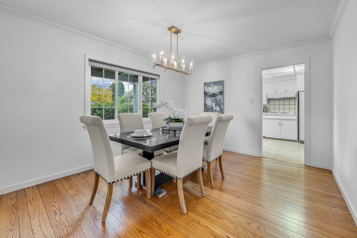 390 Cecelia Way Los Altos, CA 94022 - Photo 8 of 48 a view of a dining room with furniture window and wooden floor