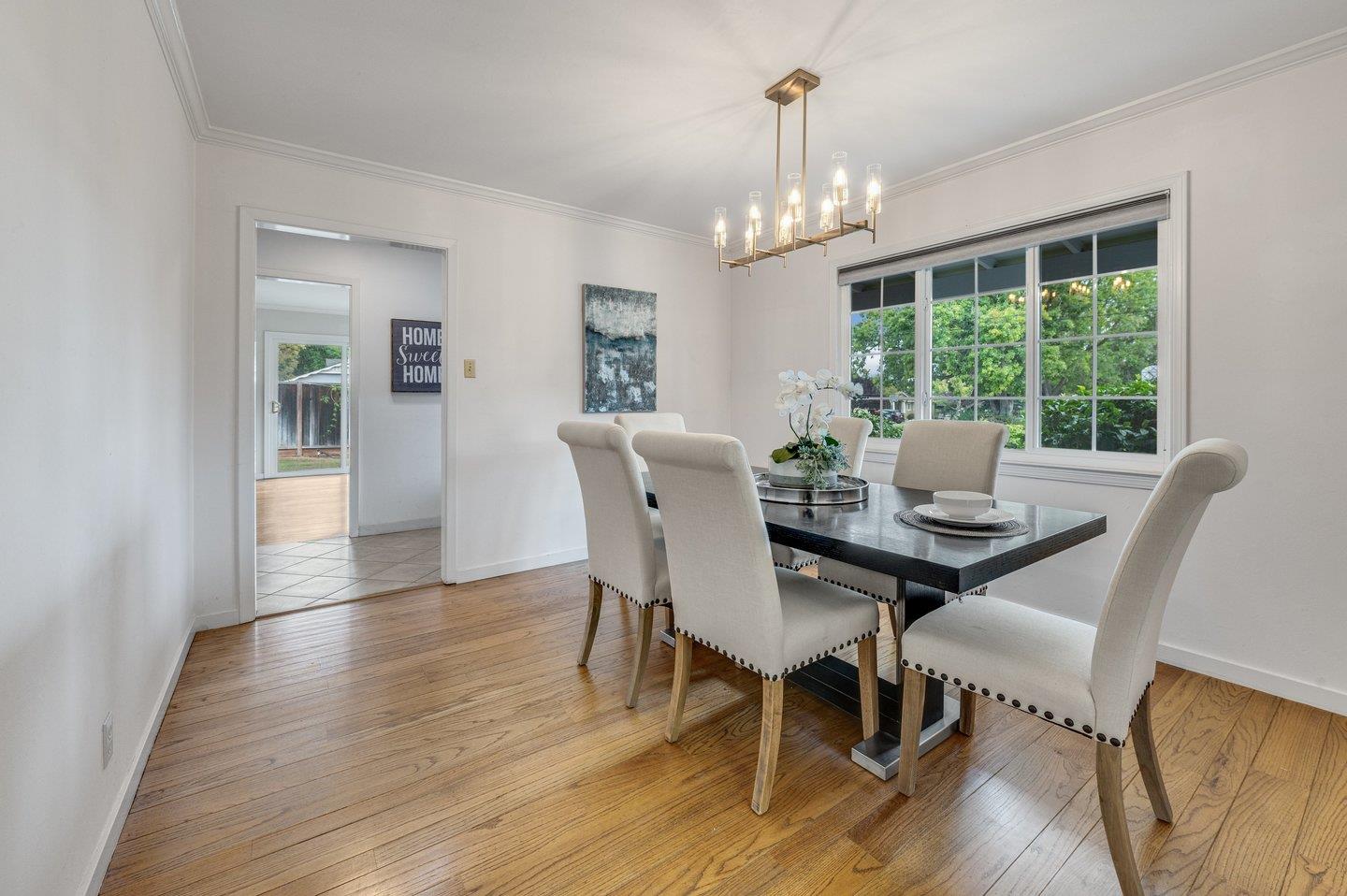 390 Cecelia Way Los Altos, CA 94022 - Photo 9 of 48 a view of a dining room with furniture window and wooden floor