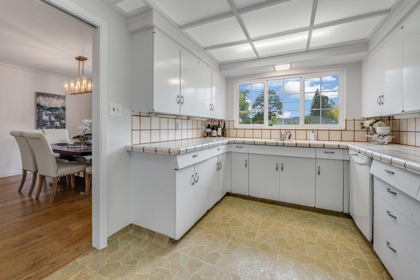 390 Cecelia Way Los Altos, CA 94022 - Photo 10 of 48 a kitchen with a sink stove and cabinets