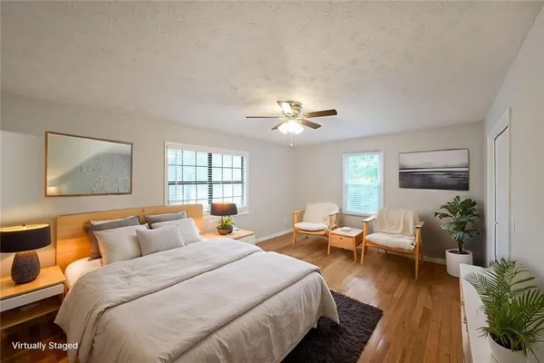 a bedroom with bed and window