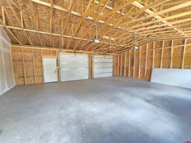a view of a room with wooden walls