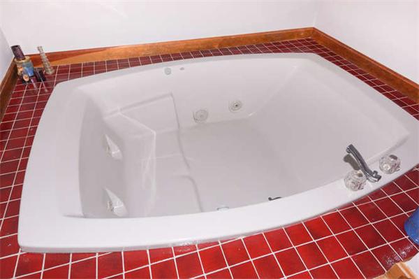 41 Frye Road Bolton, MA 01740 - Photo 13 of 24 a close up of a bathtub