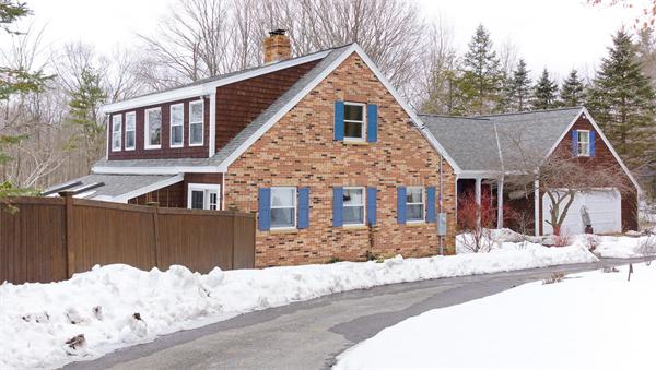 41 Frye Road Bolton, MA 01740 - Photo 18 of 24 a front view of house with snow on the road