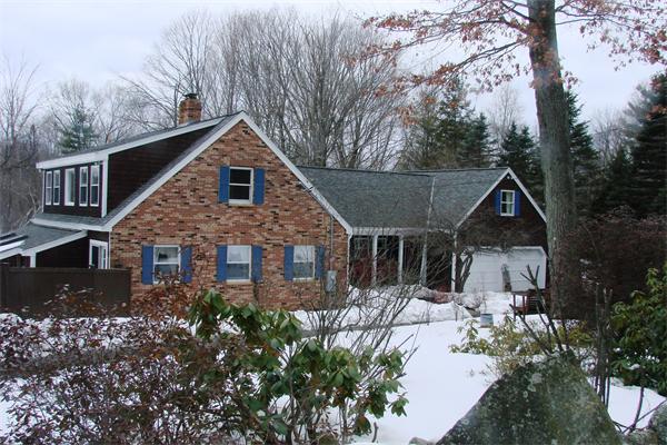 41 Frye Road Bolton, MA 01740 - Photo 21 of 24 a front view of a house with yard and green space